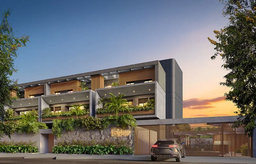 Vista Geral do Prédio: Fachada moderna do condomínio Insignia Península na Barra da Tijuca com arquitetura contemporânea e grandes varandas de vidro.